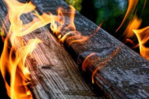 charred wood and flames